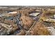 Stunning aerial view of a neighborhood with lush trees and a cityscape in the distance at 1376 Stirling Nw Cir, Atlanta, GA 30318