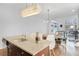 Modern kitchen island with granite countertop, stainless steel sink, and seating for four at 1376 Stirling Nw Cir, Atlanta, GA 30318