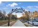 Scenic view of the Woodall Rail Trail entrance with artistic metalwork at 1376 Stirling Nw Cir, Atlanta, GA 30318