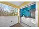 Bright outdoor kitchen with a sink, mini refrigerator, and white cabinetry at 1376 Stirling Nw Cir, Atlanta, GA 30318