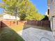 This backyard features a wooden fence and a concrete patio at 2016 Barberry Dr, Buford, GA 30519