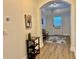 This hallway features hardwood floors and an arched ceiling at 2016 Barberry Dr, Buford, GA 30519