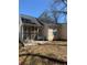 Back of home with screened in porch and concrete patio at 3133 West Point Cir, Douglasville, GA 30134