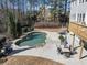 Relaxing backyard pool area with ample seating and mature trees at 118 Savanna Estates Dr, Canton, GA 30115