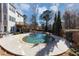 Beautiful backyard pool with stone accents and a spacious concrete patio at 118 Savanna Estates Dr, Canton, GA 30115