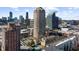 Stunning aerial view of a cityscape featuring luxury residences, modern buildings, and a beautiful pool at 3475 Oak Valley Ne Rd # 410, Atlanta, GA 30326