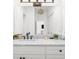Elegant bathroom with a marble countertop, dual sinks, and a stylish, modern pendant light at 3475 Oak Valley Ne Rd # 410, Atlanta, GA 30326