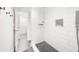 Modern bathroom features a spacious walk-in shower with a black herringbone shower floor at 3475 Oak Valley Ne Rd # 410, Atlanta, GA 30326