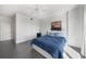 Bedroom boasts stylish gray floors, a modern fan, and a comfortable bed with stylish blue accents at 3475 Oak Valley Ne Rd # 410, Atlanta, GA 30326