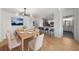 Inviting dining area with a modern chandelier, elegant seating, and an open view of the kitchen at 3475 Oak Valley Ne Rd # 410, Atlanta, GA 30326