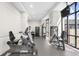 Community gym with workout machines and a large mirror at 3475 Oak Valley Ne Rd # 410, Atlanta, GA 30326