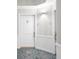 Clean hallway entrance featuring white doors, textured walls, and patterned flooring at 3475 Oak Valley Ne Rd # 410, Atlanta, GA 30326