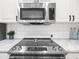 Updated kitchen with stainless steel appliances and white cabinets at 3475 Oak Valley Ne Rd # 410, Atlanta, GA 30326
