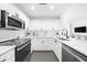 Bright kitchen featuring stainless steel appliances, subway tile backsplash and white cabinetry at 3475 Oak Valley Ne Rd # 410, Atlanta, GA 30326