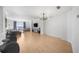 Spacious living area with hardwood floors, stylish lighting, and a comfortable seating arrangement at 3475 Oak Valley Ne Rd # 410, Atlanta, GA 30326