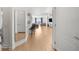 Bright, open-concept living space with hardwood floors, stylish bar stools, and contemporary furnishings at 3475 Oak Valley Ne Rd # 410, Atlanta, GA 30326