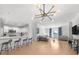 Open-concept living space with hardwood floors, a modern kitchen, and comfortable seating at 3475 Oak Valley Ne Rd # 410, Atlanta, GA 30326