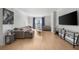 Spacious living room featuring hardwood floors, large windows, and modern decor at 3475 Oak Valley Ne Rd # 410, Atlanta, GA 30326
