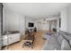 Spacious living room with hardwood floors, neutral tones, and a large TV at 3475 Oak Valley Ne Rd # 410, Atlanta, GA 30326