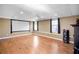 Entertainment basement with a projector, hardwood floors, and ample space for gatherings at 4046 Harvest Ridge Dr, Douglasville, GA 30135