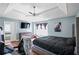 Spacious bedroom featuring a gray accent wall, modern bed frame and view of a connected bathroom at 4046 Harvest Ridge Dr, Douglasville, GA 30135