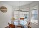 Cozy breakfast nook with lots of light, complemented by a modern glass table and chairs at 4046 Harvest Ridge Dr, Douglasville, GA 30135