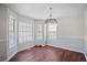 Bright dining room featuring a large bay window and stylish chandelier, perfect for Gathering gatherings at 4046 Harvest Ridge Dr, Douglasville, GA 30135
