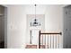 Bright foyer area with hardwood floors, a chandelier, and natural light creating an inviting entryway at 4046 Harvest Ridge Dr, Douglasville, GA 30135
