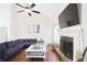 Comfortable living room area featuring a fireplace, hardwood floors, vaulted ceiling, and modern amenities at 4046 Harvest Ridge Dr, Douglasville, GA 30135
