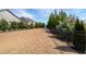 Large backyard with lush greenery, privacy fencing, and ample space for outdoor activities at 505 Windy Ridge Ct, Canton, GA 30114