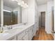 Bathroom features a double sink vanity, quartz countertops, and walk-in shower at 505 Windy Ridge Ct, Canton, GA 30114