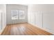 Bedroom featuring board and batten and wood floors at 505 Windy Ridge Ct, Canton, GA 30114