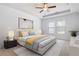 Inviting bedroom with neutral tones, a tray ceiling, and plenty of natural light at 505 Windy Ridge Ct, Canton, GA 30114