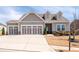 Charming home featuring a three-car garage, neutral paint, and well-maintained landscaping at 505 Windy Ridge Ct, Canton, GA 30114