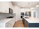 Modern kitchen features stainless steel appliances and white countertops at 505 Windy Ridge Ct, Canton, GA 30114