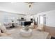Bright, open-concept living space flows into a modern kitchen with a large island and stainless steel appliances at 505 Windy Ridge Ct, Canton, GA 30114