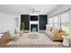 Spacious living room with dark accent wall, fireplace and furniture at 505 Windy Ridge Ct, Canton, GA 30114