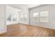 Bright living area featuring beautiful wood floors and plenty of natural light from the many windows at 505 Windy Ridge Ct, Canton, GA 30114