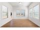 Sunlit living room featuring wood floors at 505 Windy Ridge Ct, Canton, GA 30114
