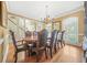 Elegant dining room featuring a large table, hardwood floors, and chandelier lighting at 1561 Annapolis Way, Grayson, GA 30017