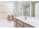 Bright bathroom with dual vanities, tile flooring, and shower visible in the mirror at 2095 Springer Walk, Lawrenceville, GA 30043