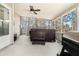 Relaxing covered porch featuring a ceiling fan, grill and a hot tub, perfect for entertaining at 2095 Springer Walk, Lawrenceville, GA 30043