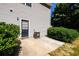 This backyard features a patio and landscaping near the back door at 215 Odyssey Turn, Conyers, GA 30012