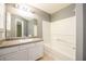 Bright bathroom features single sink vanity, tub and shower combo at 215 Odyssey Turn, Conyers, GA 30012