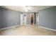 Spacious carpeted bedroom with ensuite and walk-in closet at 215 Odyssey Turn, Conyers, GA 30012