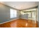 Bright dining area with hardwood floors, open to the kitchen, and featuring a stylish chandelier at 215 Odyssey Turn, Conyers, GA 30012