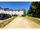 Exterior of property with car parked and driveway at 215 Odyssey Turn, Conyers, GA 30012