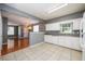 Open kitchen view with breakfast bar and a view of the living room at 215 Odyssey Turn, Conyers, GA 30012