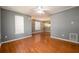 Open living room with hardwood floors and natural light at 215 Odyssey Turn, Conyers, GA 30012