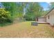 Backyard with a mix of greenery, a shed, and a charming house featuring a wooden deck at 3363 Briarcliff Ne Rd, Atlanta, GA 30345